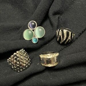 4 beautiful silver tone statement rings